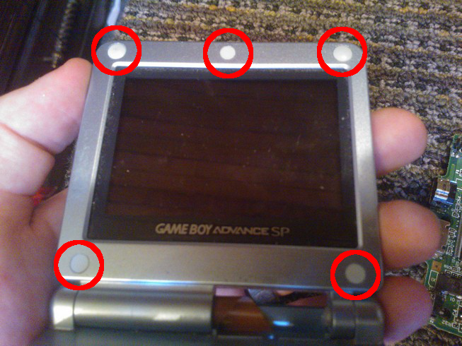 The five pads surrounding the bezel of the screen highlighted
